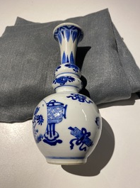 A Chinese blue and white triple gourd 'antiquities' vase, Kangxi