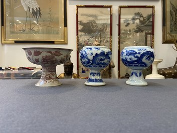A pair of Chinese blue and white 'dragon' stem cups and one in copper-red, 19/20th C.