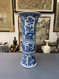 A Chinese blue and white 'gu' vase with floral and lanscape panels, Kangxi