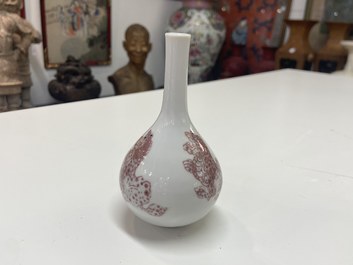 A small Chinese copper-red bottle vase with Buddhist lions, Kangxi