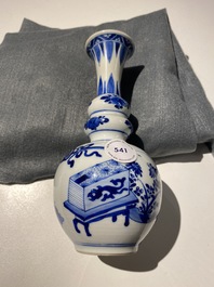 A Chinese blue and white triple gourd 'antiquities' vase, Kangxi
