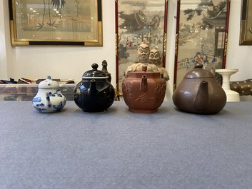 Four Chinese Yixing stoneware, blue and white and monochrome black porcelain teapots, Kangxi and later