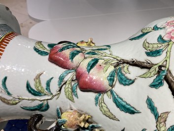 A Chinese famille rose molded 'nine peaches' vase, 19th C.