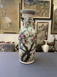 A Chinese famille rose molded 'nine peaches' vase, 19th C.