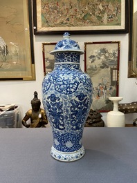 A Chinese blue and white vase and cover with floral design, Kangxi
