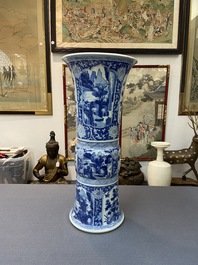 A Chinese blue and white 'gu' vase with floral and lanscape panels, Kangxi