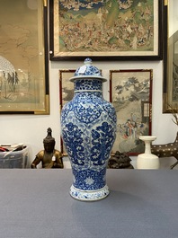 A Chinese blue and white vase and cover with floral design, Kangxi