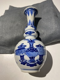 A Chinese blue and white triple gourd 'antiquities' vase, Kangxi