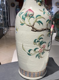 A Chinese famille rose molded 'nine peaches' vase, 19th C.