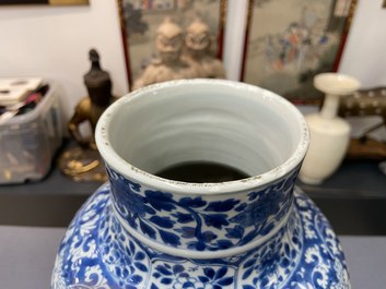 A Chinese blue and white vase and cover with floral design, Kangxi