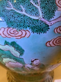 A pair of large Chinese turquoise-ground famille verte vases and covers, 19th C.
