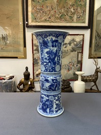 A Chinese blue and white 'gu' vase with floral and lanscape panels, Kangxi