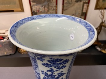 A Chinese blue and white 'gu' vase with floral and lanscape panels, Kangxi