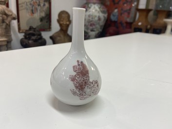 A small Chinese copper-red bottle vase with Buddhist lions, Kangxi