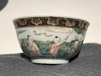 A Chinese famille rose 'harvesting' cup and saucer, Yongzheng