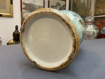 A pair of Chinese famille rose turquoise-ground vases with butterfly handles, 19th C.