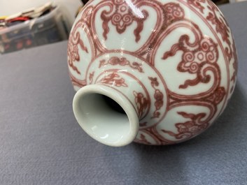 A Chinese copper-red 'meiping' vase with peony scrolls, Qianlong mark, 19/20th C.