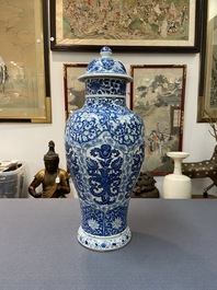 A Chinese blue and white vase and cover with floral design, Kangxi