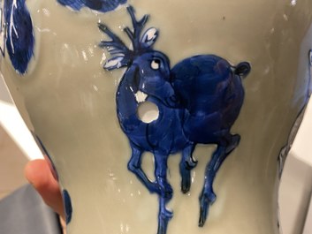 A Chinese blue, white and copper-red celadon-ground 'birds and deer' vase, Kangxi