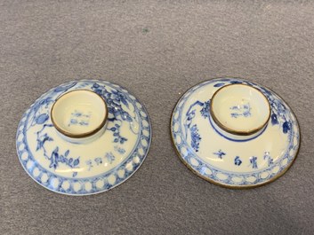 A pair of Chinese blue and white covered bowls on stands and a pair of covered jars, 19th C.