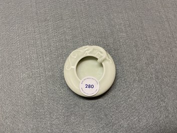 A Chinese celadon-glazed 'dragon' brush washer, Qianlong mark, 19/20th C.