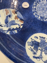 A Chinese blue, white and copper-red powder-blue-ground dish, Kangxi