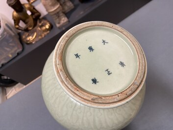 A Chinese monochrome celadon-glazed 'yuhuchunping' vase with underglaze floral design, Kangxi mark, 19th C.
