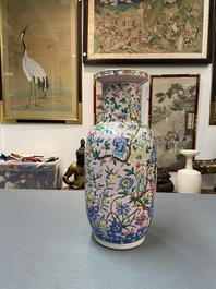 A Chinese pink-ground famille rose rouleau vase, 19th C.