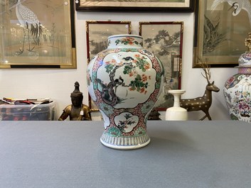 A Chinese famille verte vase with birds near flowery branches, Kangxi