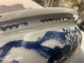 A Chinese blue and white tripod censer with figures in a mountainous landscape, Kangxi