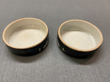 A pair of Chinese famille noire jars and covers, 19th C.