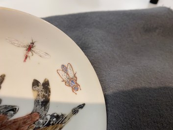 A Chinese famille rose 'bird and insects' cup and saucer, Yongzheng