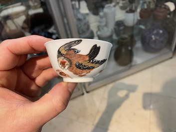 A Chinese famille rose 'bird and insects' cup and saucer, Yongzheng
