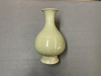 A Chinese monochrome celadon-glazed 'yuhuchunping' vase with underglaze floral design, Kangxi mark, 19th C.