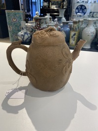 A Chinese Yixing stoneware teapot with squirrels and butterflies, seal mark, 18th C.