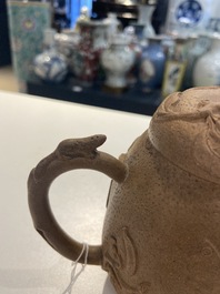 A Chinese Yixing stoneware teapot with squirrels and butterflies, seal mark, 18th C.