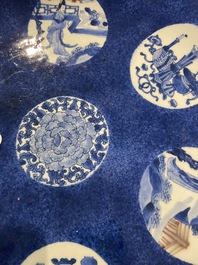 A Chinese blue, white and copper-red powder-blue-ground dish, Kangxi