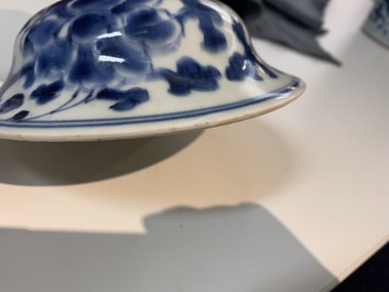A pair of Chinese blue and white 'peony scroll' vases and covers, Kangxi