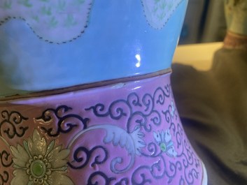 A pair of Chinese famille rose turquoise-ground vases with butterfly handles, 19th C.
