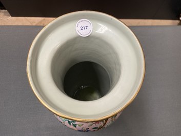 A Chinese pink-ground famille rose rouleau vase, 19th C.
