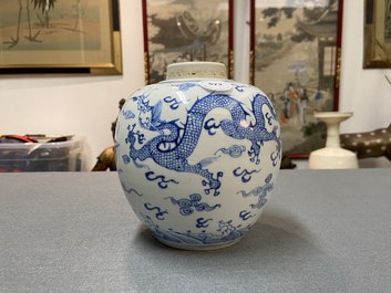 A Chinese blue and white 'dragon and phoenix' jar with wooden lid, Chenghua mark, Kangxi