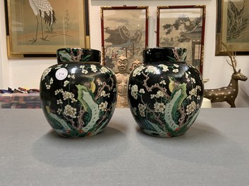 A pair of Chinese famille noire jars and covers, 19th C.