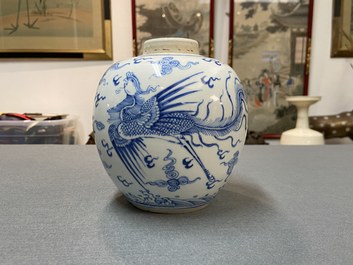 A Chinese blue and white 'dragon and phoenix' jar with wooden lid, Chenghua mark, Kangxi