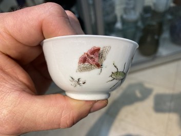 A Chinese famille rose 'bird and insects' cup and saucer, Yongzheng