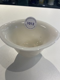 A Chinese Dehua blanc de Chine tripod wine cup with inscription, Kangxi