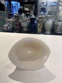 A Chinese Dehua blanc de Chine tripod wine cup with inscription, Kangxi