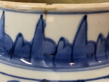 A pair of Chinese blue and white 'peony scroll' vases and covers, Kangxi