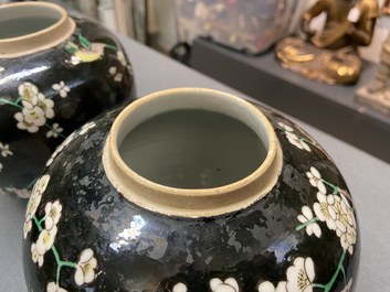 A pair of Chinese famille noire jars and covers, 19th C.