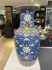 A Chinese famille rose blue-ground 'bajixiang' vase, 19th C.