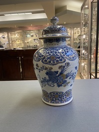 A Chinese gilt-heightened blue and white vase and cover, Kangxi/Yongzheng